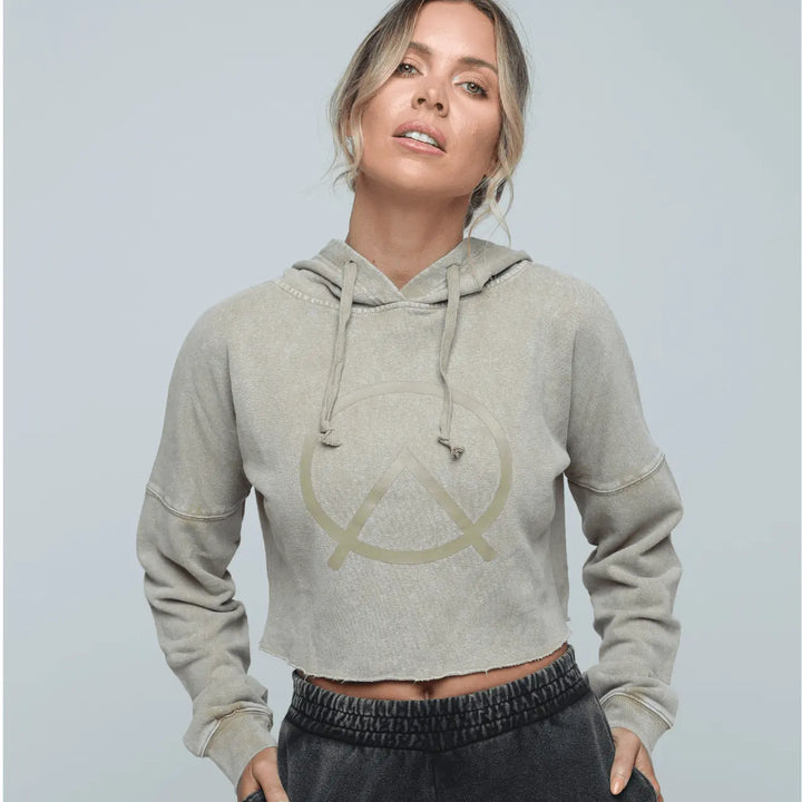Woman wearing Zone by Lydia hemp Cropped Hoodie in sand paired with hemp jogger in vintage black.