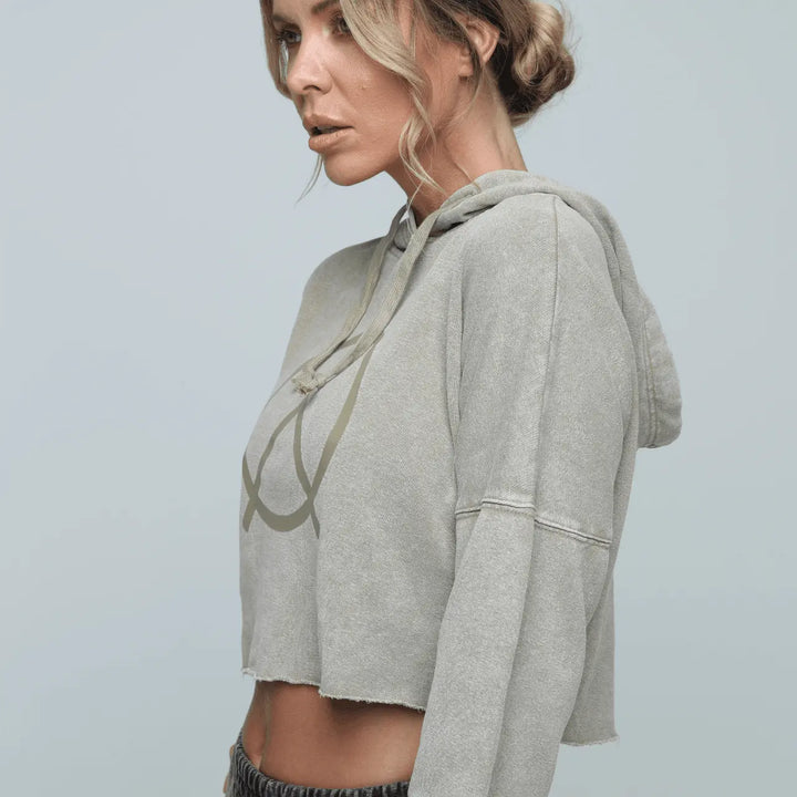 Side view of woman wearing Zone by Lydia hemp Cropped Hoodie in sand