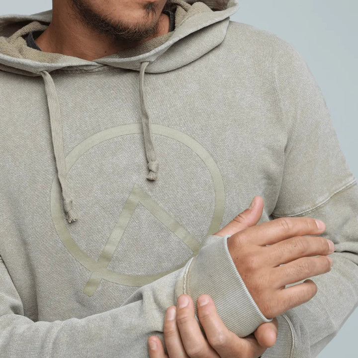 Close up of Zone branding on hemp cropped hoodie in sand