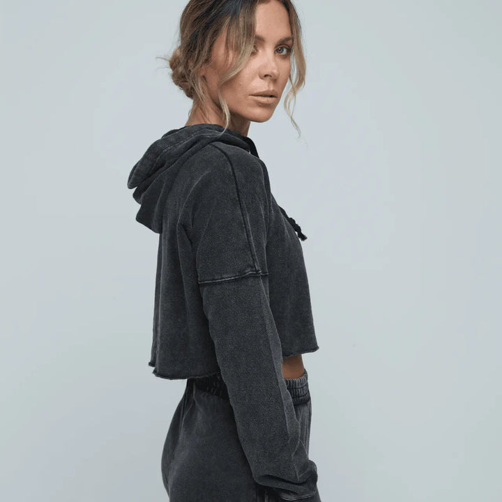 Woman side on wearing Zone by Lydia hemp Cropped Hoodie and jogger in vintage black