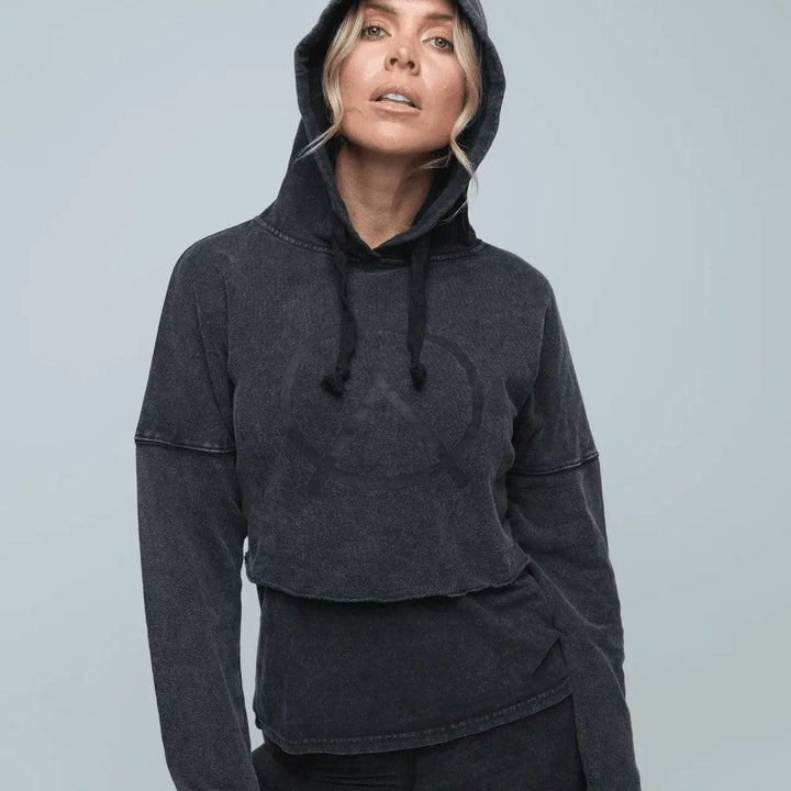 Woman wearing sustainable hemp Cropped Hoodie  layered with muscle tee in vintage black