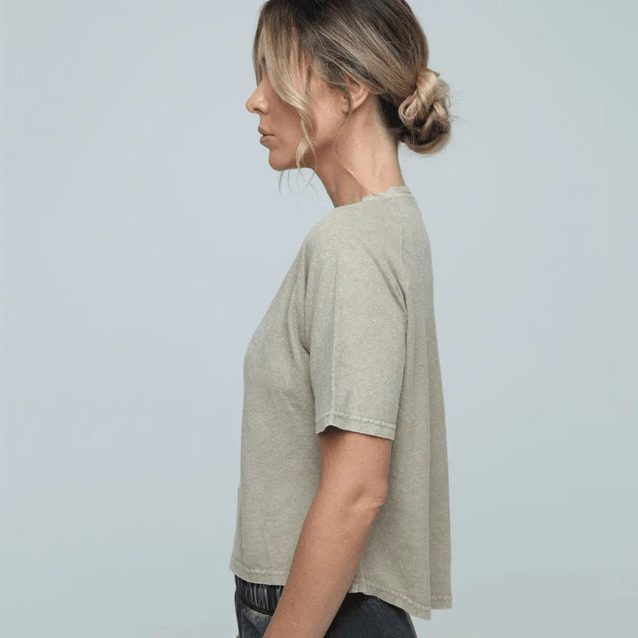 side view woman wearing Zone eco-friendly luxe Hemp Tee with scooped back in sand colour